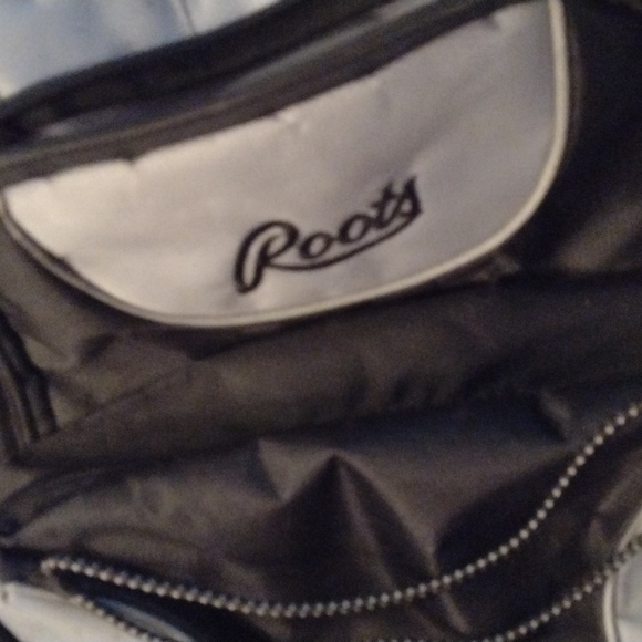 ROOTS WHEELED CARRY ON.  NUMEROUS COMPARTMENTS.  GENTLY USED. - Picture 8 of 9